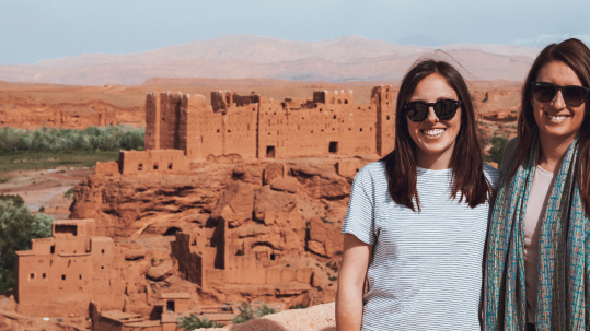 Is Morocco safe for female travelers? Female travelers enjoying a safe and scenic journey through the vibrant streets of Marrakech, Morocco, showcasing the country's rich culture and welcoming atmosphere for solo women travelers.